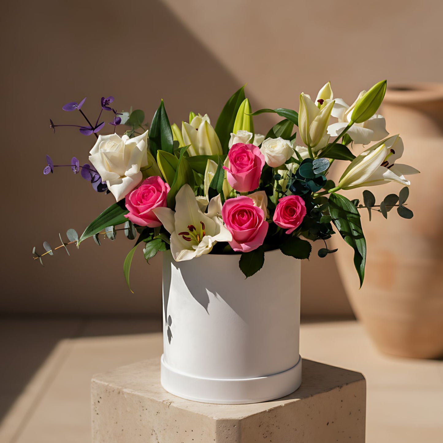 Blooming You white velvet box arrangement with fresh roses, lilies, and eucalyptus by Aiwa Flowers Dubai