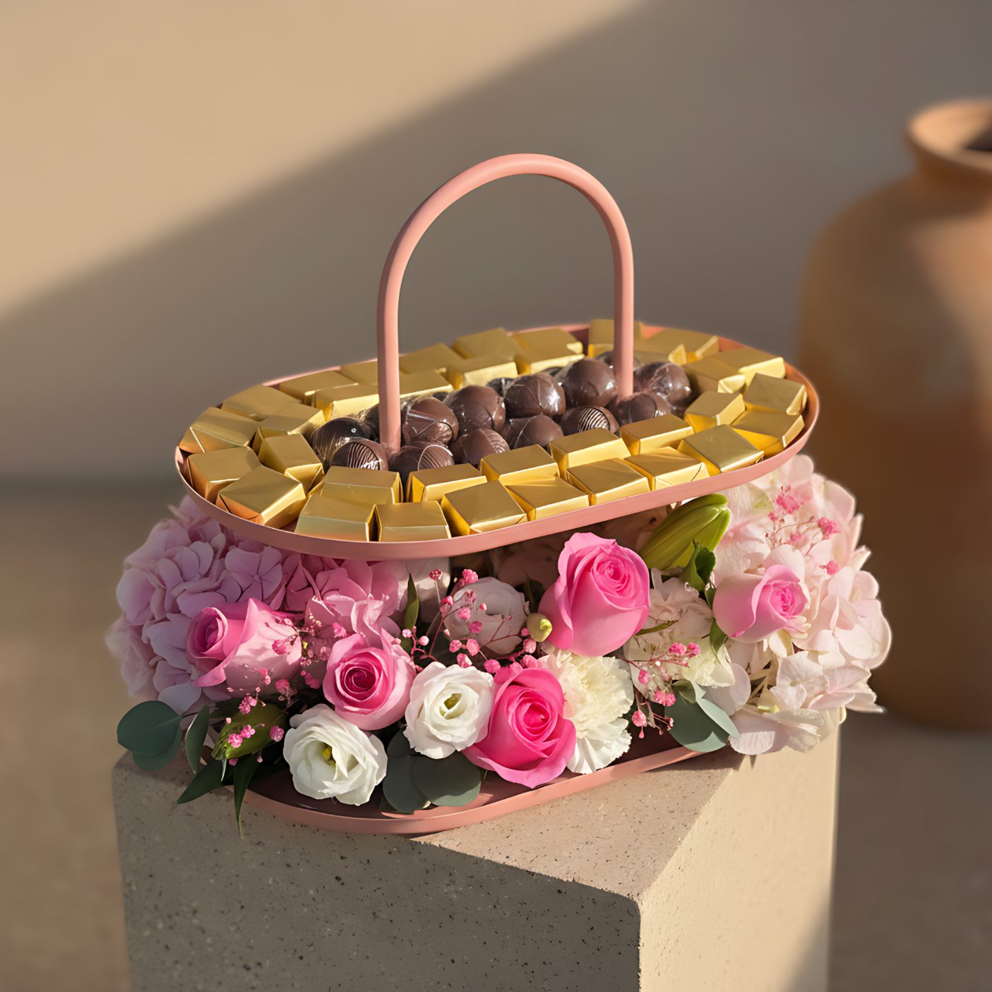 Congrat's Chocolate Tray 2 floral arrangement with pink roses, white carnations, hydrangeas, lisianthus, lilies, and chocolates in a pink tray by Aiwa Flowers Dubai