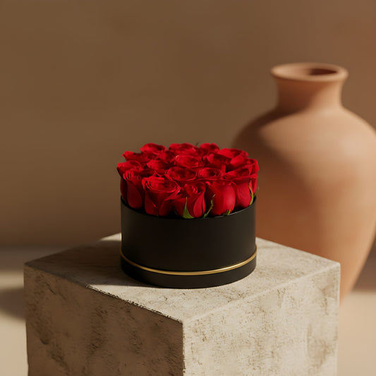 Strong Red black box arrangement with fresh red roses by Aiwa Flowers Dubai