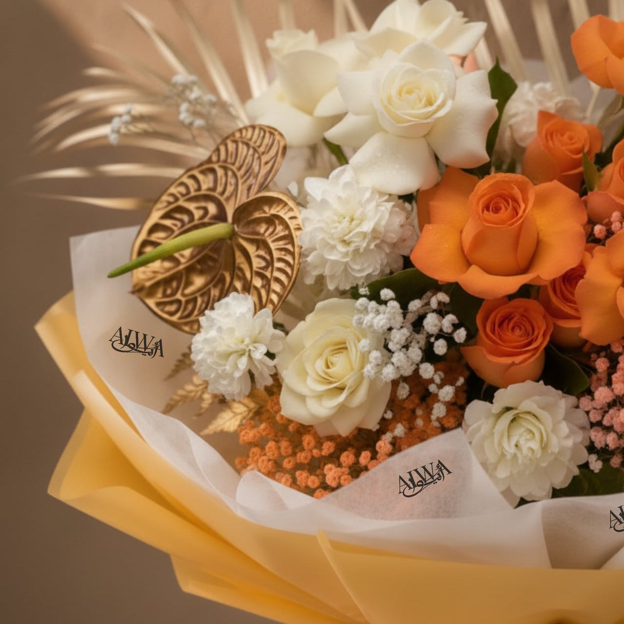 Close-up of orange roses, white roses and gold anthurium by AIWA Flowers Dubai