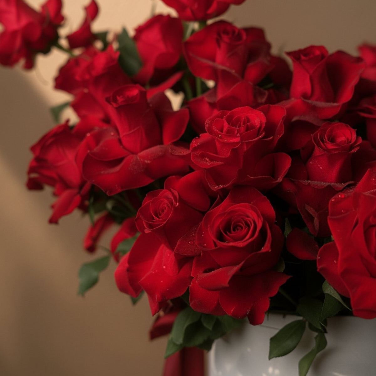 Close-up of red roses in a white gift box by AIWA Flowers Dubai