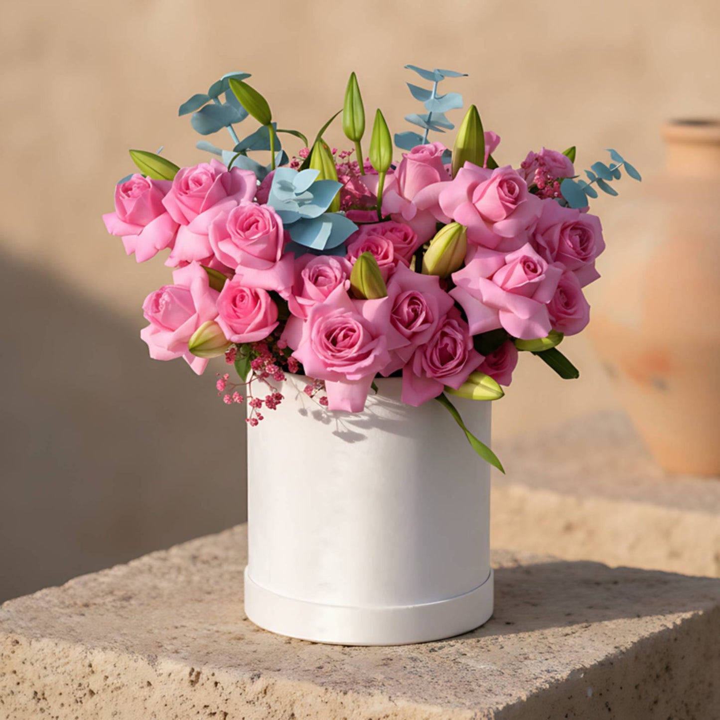 Mauvelous white velvet flower box with pink roses, white lilies, blue eucalyptus and pink gypsophila