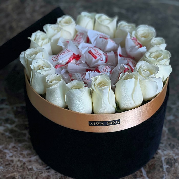 Chocolate with White Roses in a Black Velvet Round Box