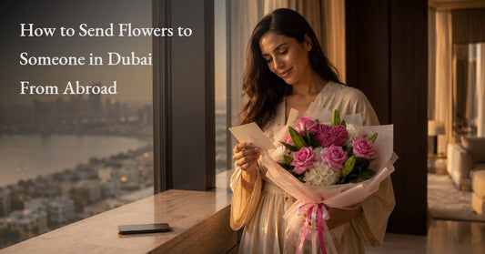 Woman in a Dubai high-rise apartment reading a card from a pink rose and carnation bouquet sent from abroad, AIWA Flowers