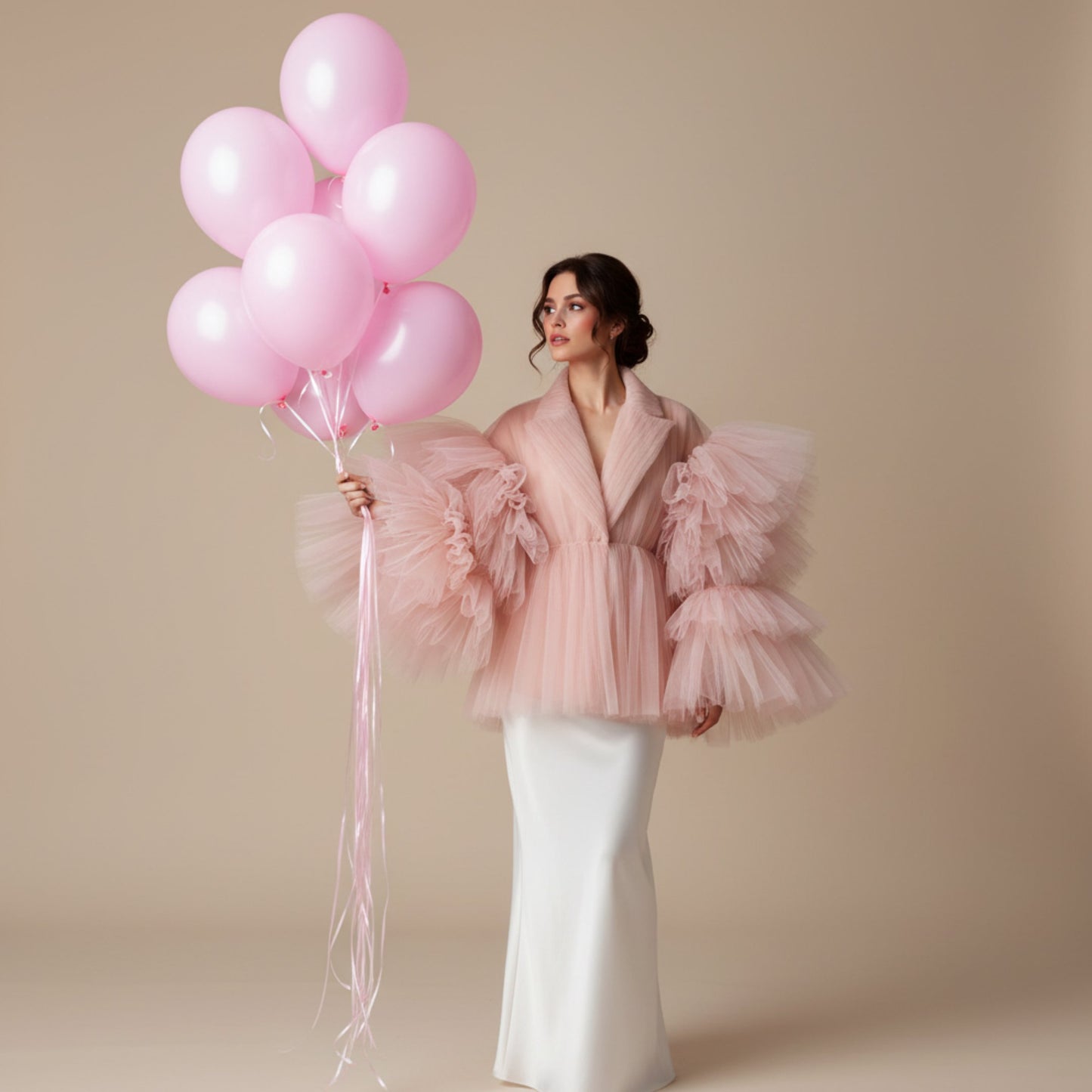 Woman holding bouquet of 10 pink helium balloons