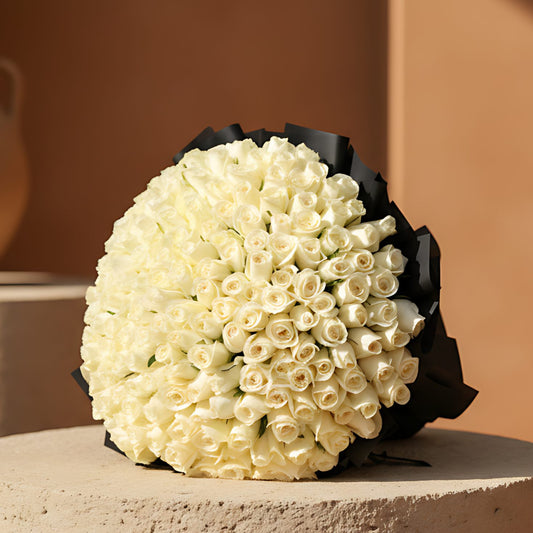 201 Black and White hand-tied bouquet with 201 fresh white roses in black wrapping by Aiwa Flowers