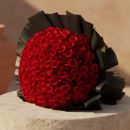 201 Charmed hand-tied bouquet with 201 fresh red roses in black wrapping by Aiwa Flowers