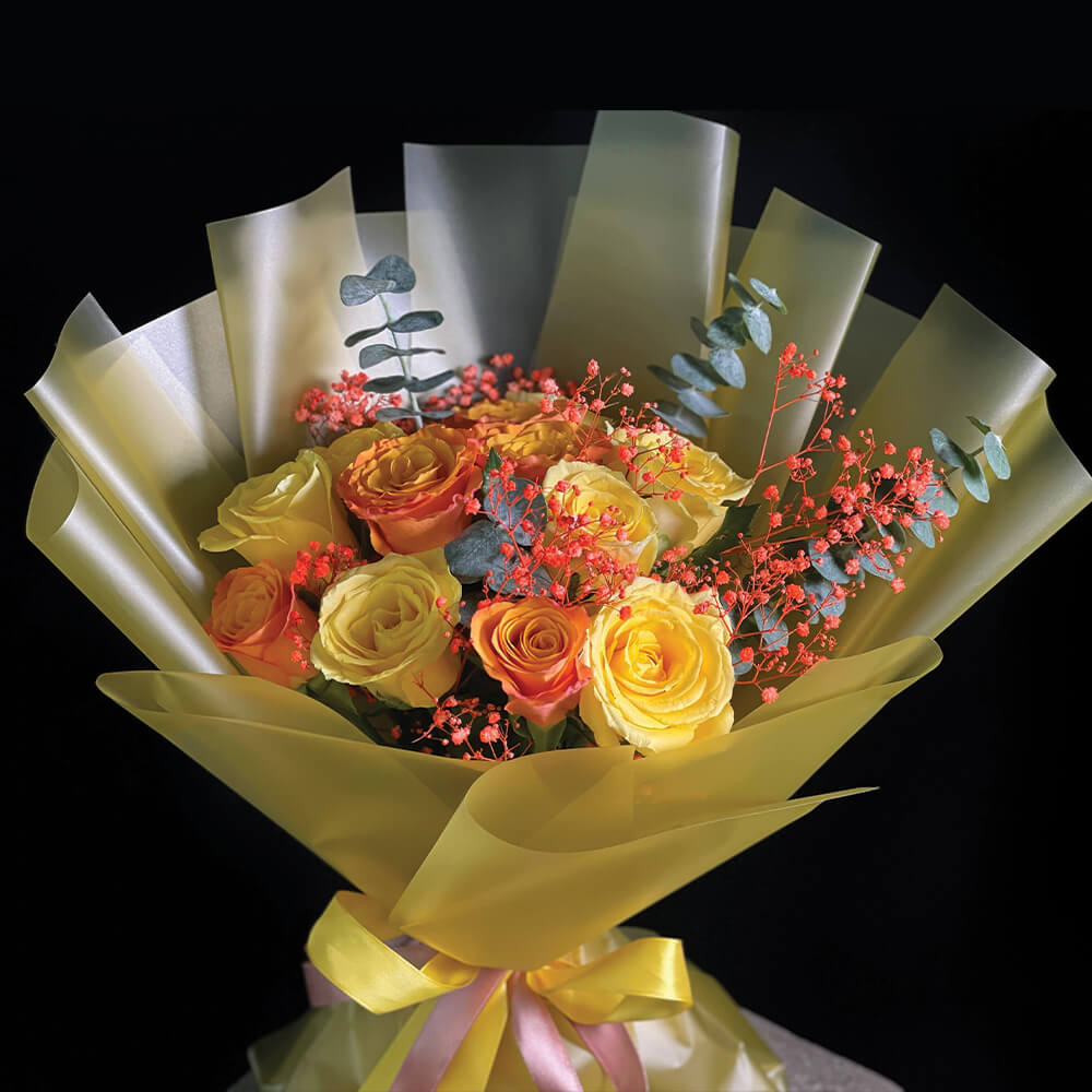 Send a vibrant and beautiful Summer Time flower bouquet with a mix of yellow and orange roses, gypsophila, and eucalyptus. Perfect for any summer occasion. Order now for same day flower delivery in Dubai, Sharjah, Abu Dhabi.