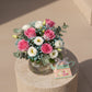 Elegant Bloom for Her Vase floral arrangement with pink roses, lisianthus and eucalyptus styled on pedestal.