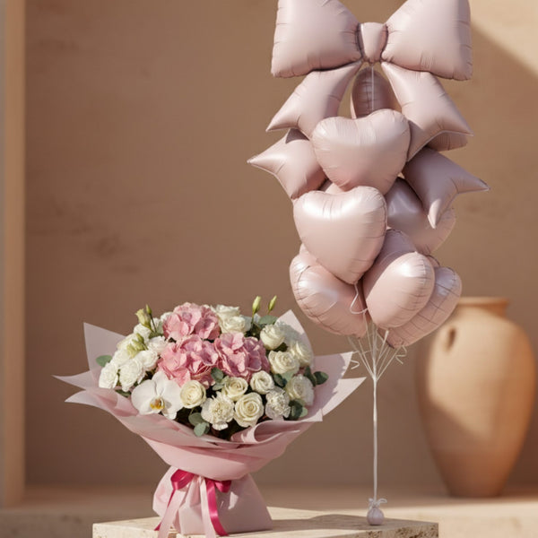 Blush Bow Bundle with pink hydrangea bouquet and blush heart balloon bouquet with large bow balloon.