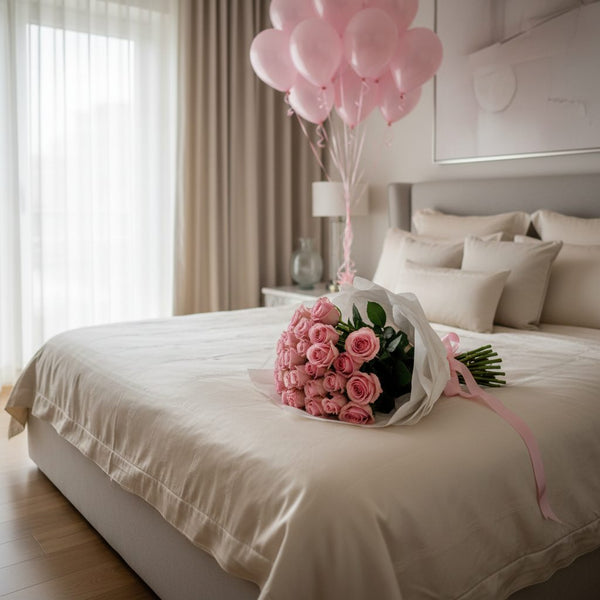 pink roses bouquet with pink helium balloons bedroom romantic surprise setup Dubai