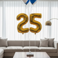 gold custom number balloon with helium balloon cluster in black royal blue and white elegant celebration Dubai