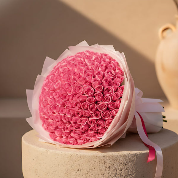 201 Rose Gelato hand-tied bouquet of 201 pink roses wrapped in light pink paper by Aiwa Flowers Dubai
