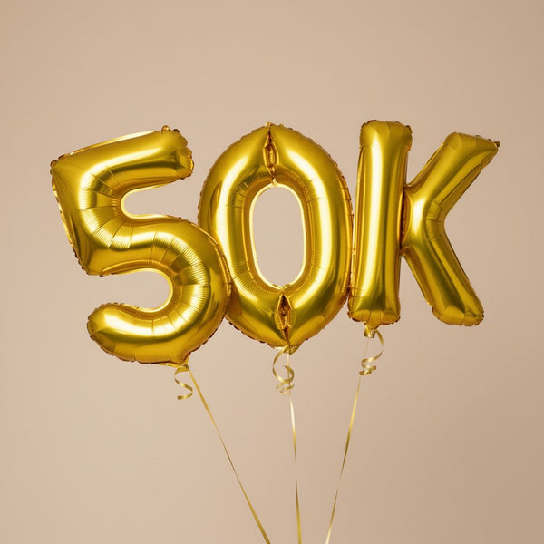 gold 50K helium balloon set for milestone celebration