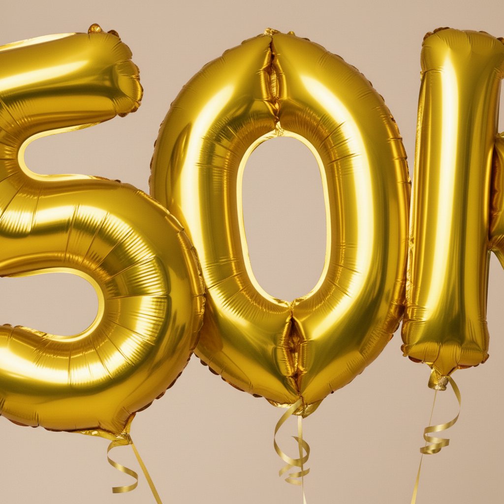 oversized gold foil balloons forming 50K with ribbons