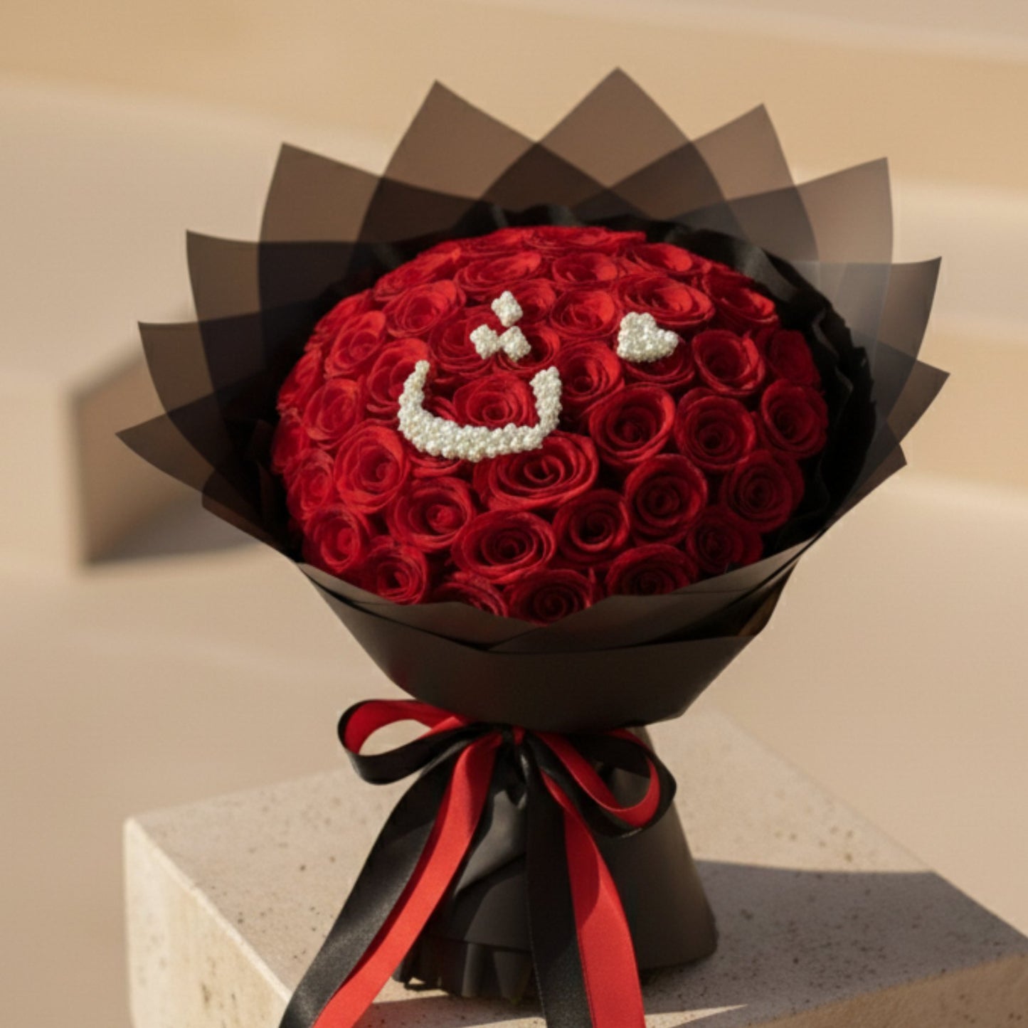 Luxury red rose bouquet with Arabic letter made from white gypsophila flowers