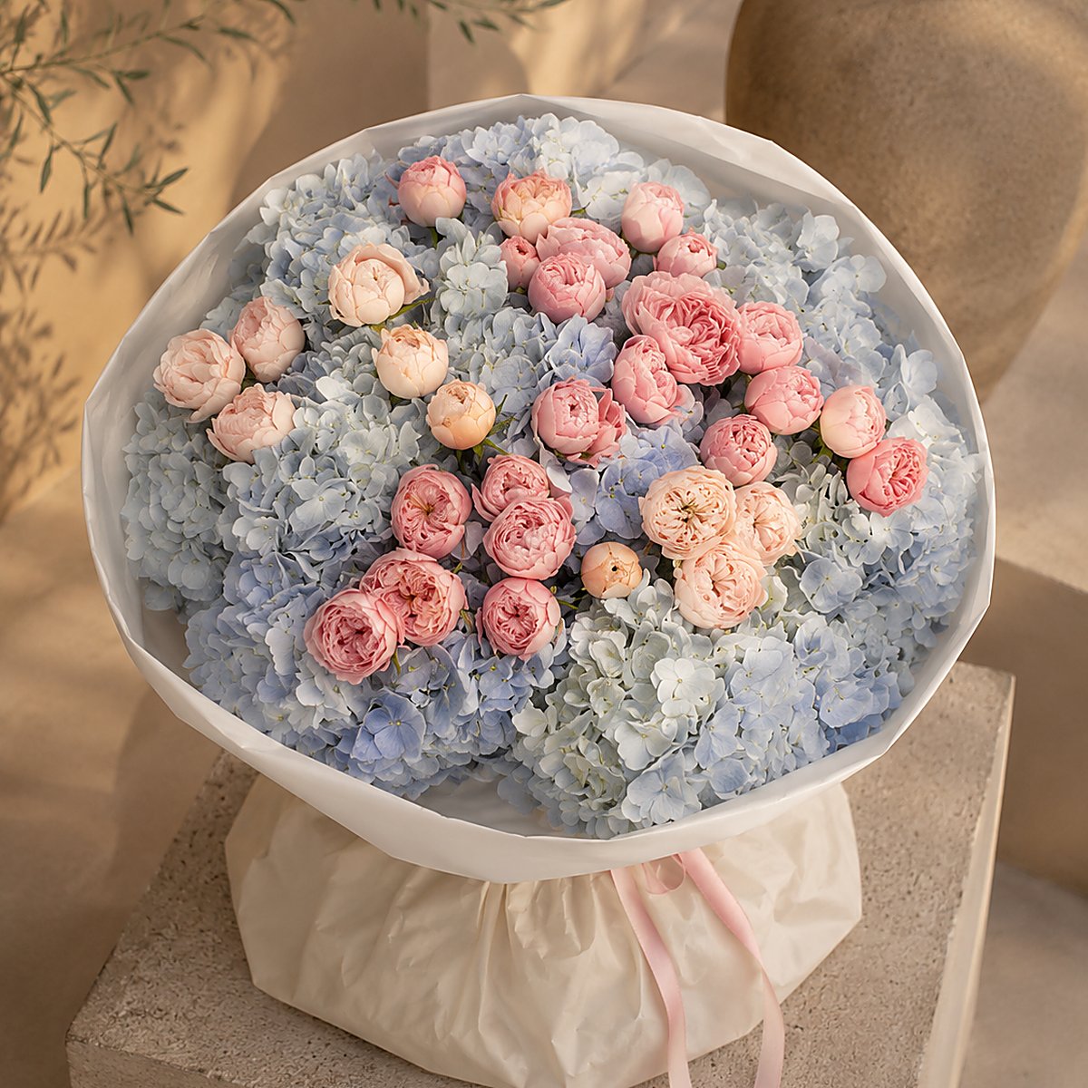 Top-down view of Azure Bloom hand-tied blue and pink bouquet by Aiwa Flowers Dubai