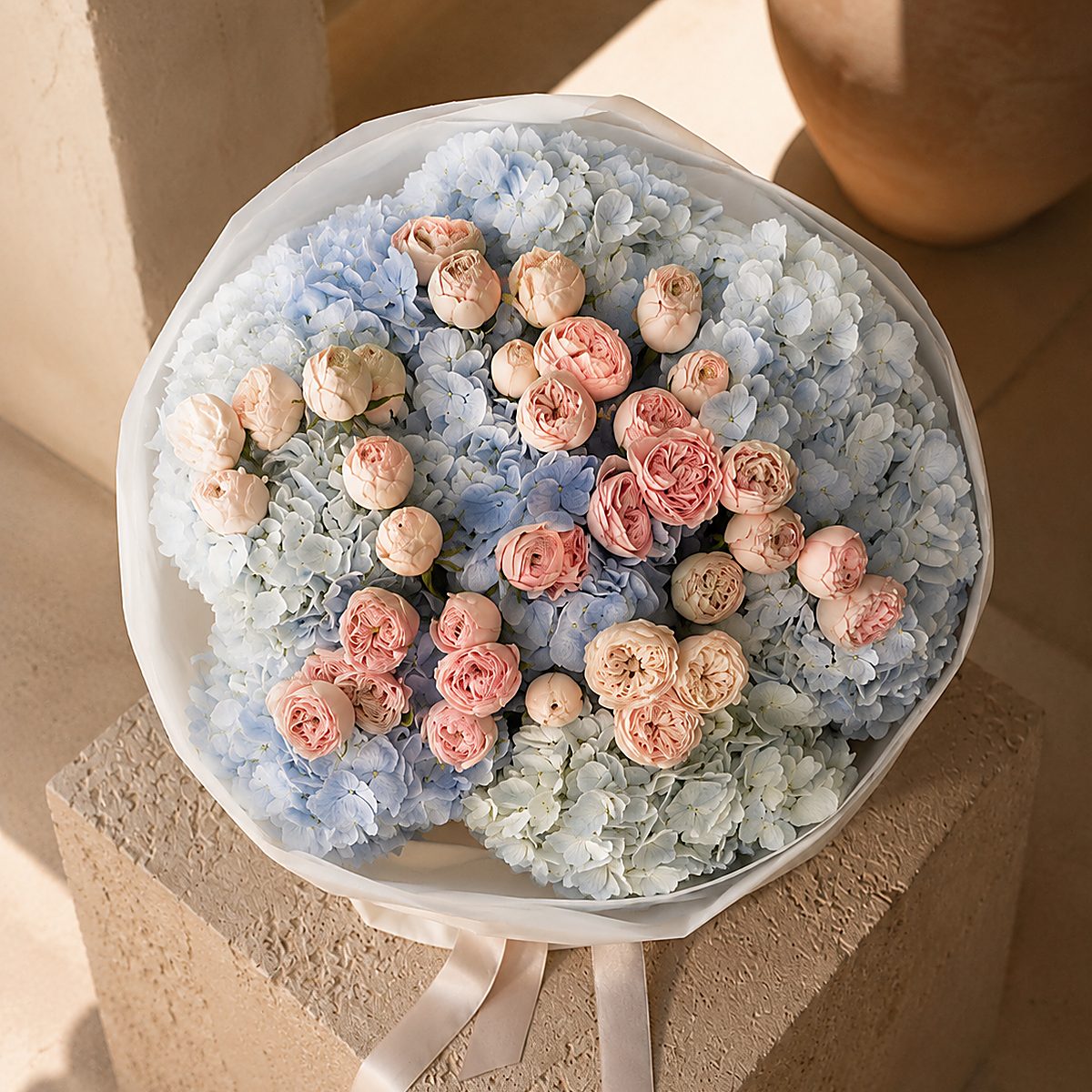 Lifestyle shot of Azure Bloom luxury bouquet styled for delivery by Aiwa Flowers Dubai