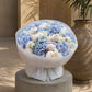 Premium blue hydrangea bouquet with white peonies and delicate white blooms in luxury white wrapping, Dubai florist creation.