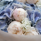 Blue Veil blue hydrangea pink peony and double stock bouquet wrapped in white by Aiwa Flowers Dubai