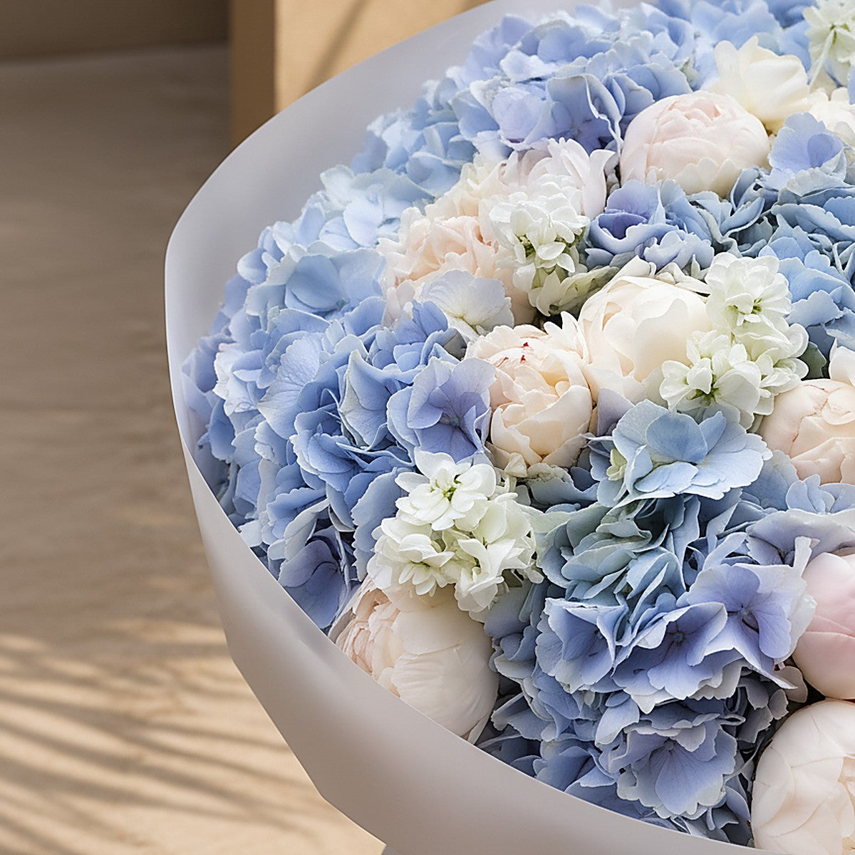 Top-down view of Blue Veil hand-tied bouquet by Aiwa Flowers Dubai