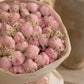 Close-up of pink peony and white chamomile in Blush Garden by Aiwa Flowers Dubai