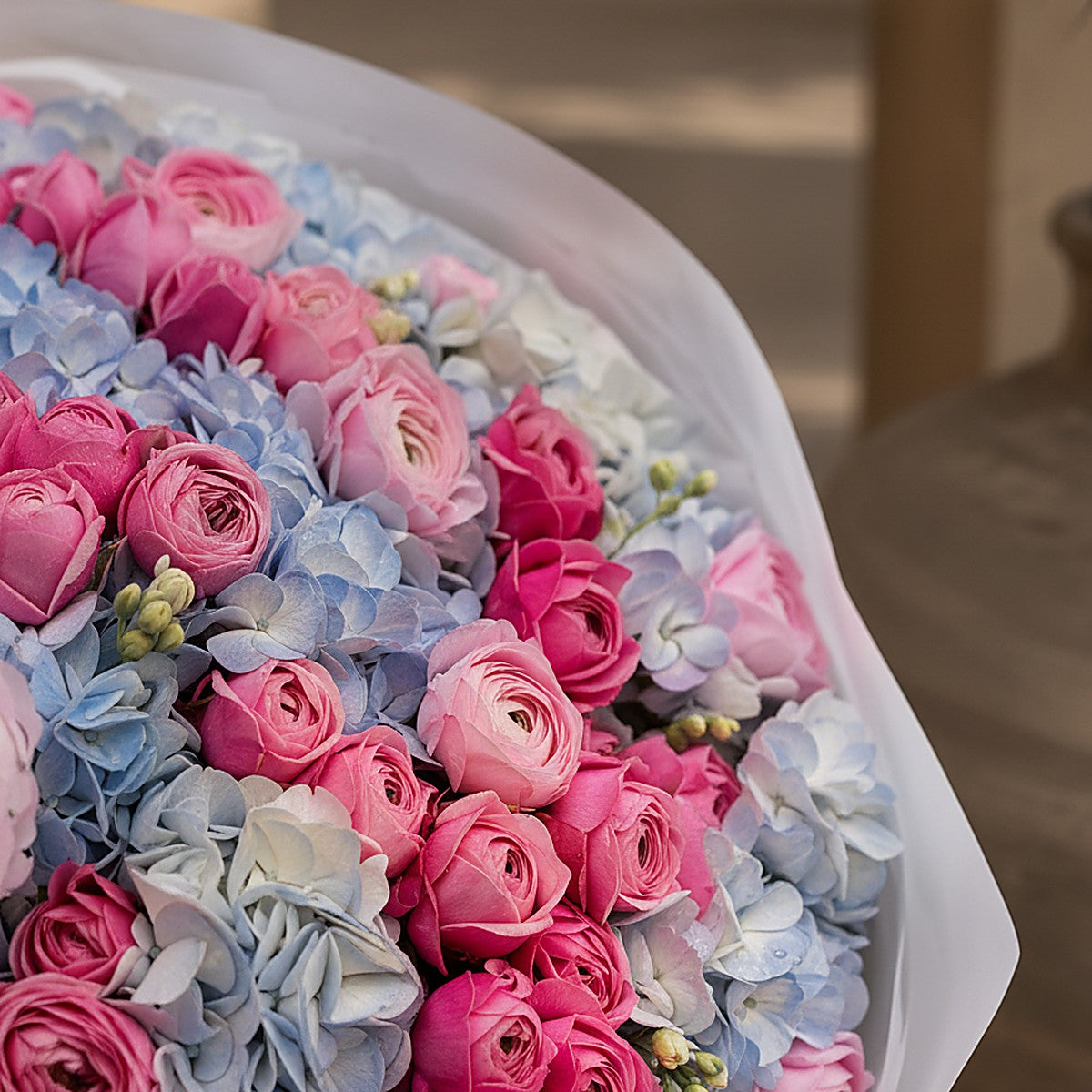Hand-tied Celestia bouquet with white freesia detail by Aiwa Flowers Dubai