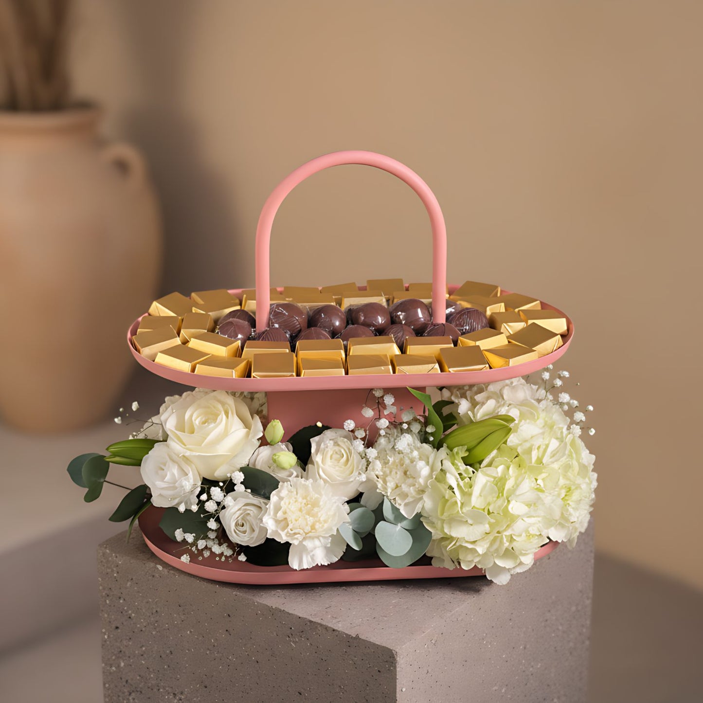 Congrat's Chocolate Tray 1 floral arrangement with white roses, carnations, hydrangeas, lisianthus, lily, and chocolates in a pink tray by Aiwa Flowers Dubai