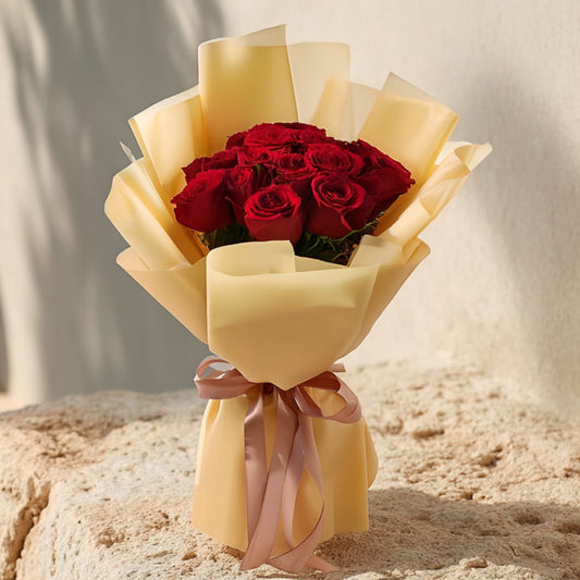 Hand-tied bouquet of 15 fresh red roses in elegant gold wrapping by Aiwa Flowers