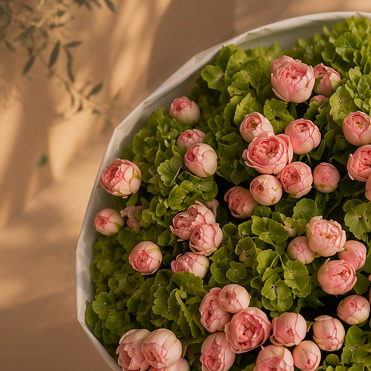 Close-up of green hydrangea and pink spray rose detail in Green Muse by Aiwa Flowers Dubai