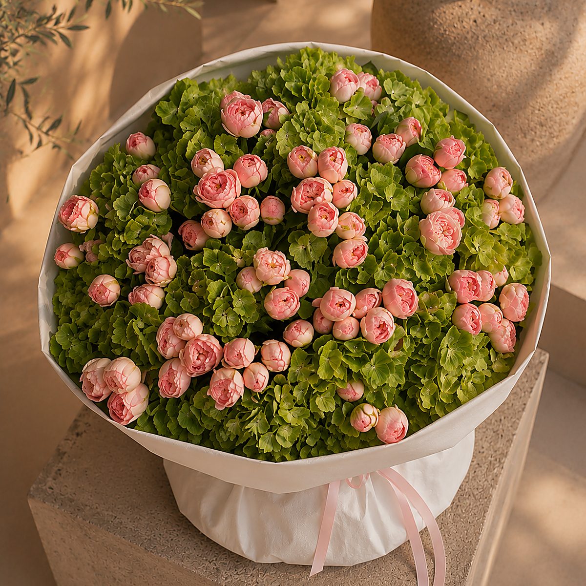 Lifestyle shot of Green Muse bouquet styled for delivery by Aiwa Flowers Dubai