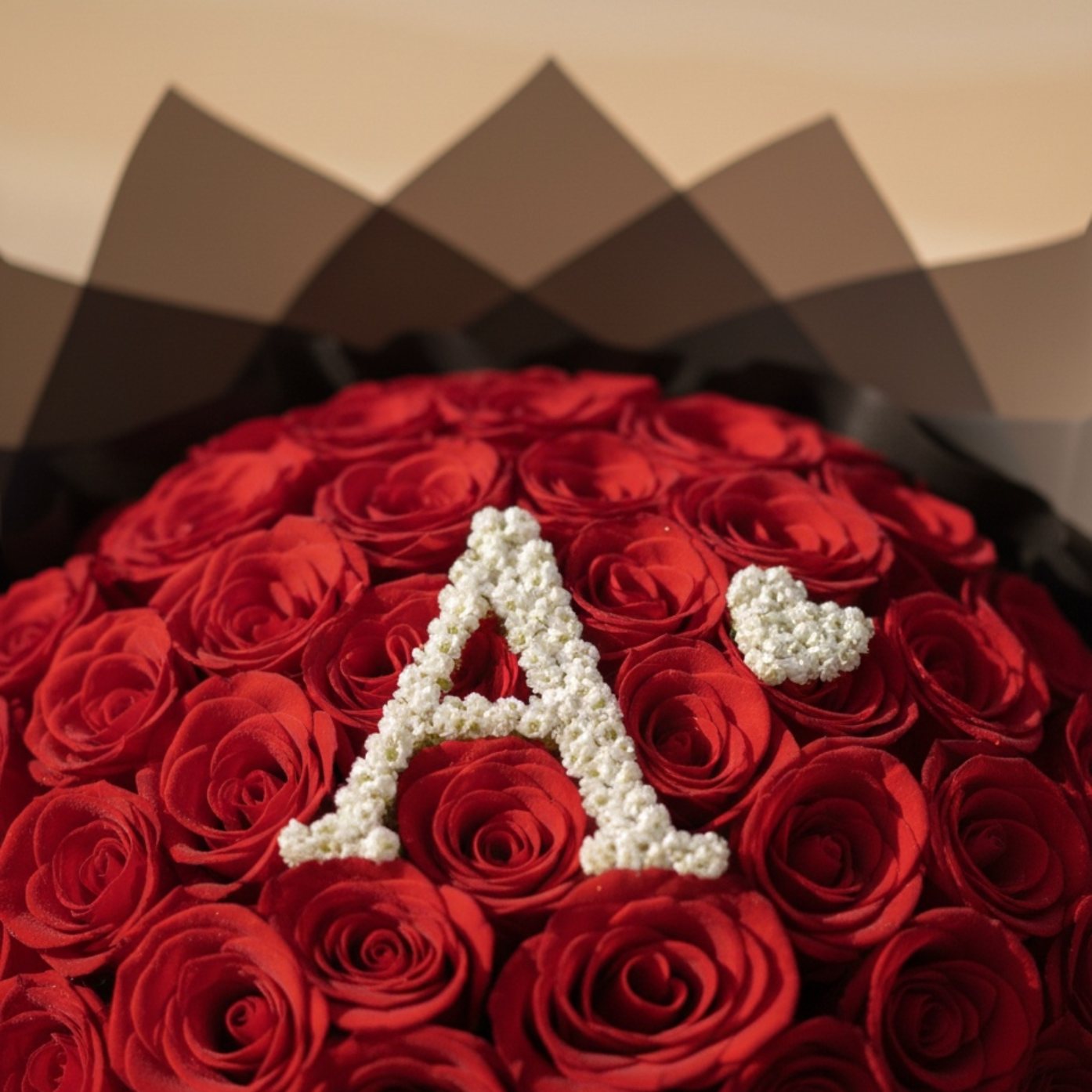 Custom initial red rose bouquet with gypsophila letter and satin ribbon by Aiwa Flowers