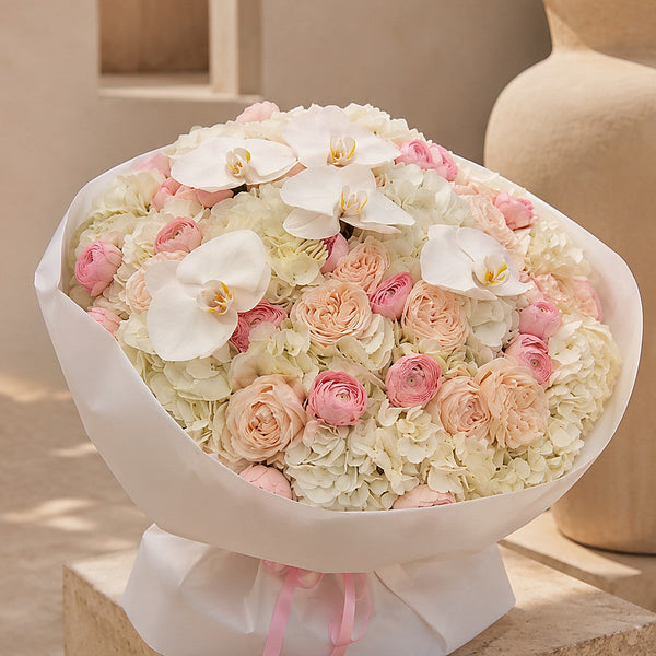 Close-up of white hydrangea petals and orchid detail in Ivory Orchid by Aiwa Flowers Dubai