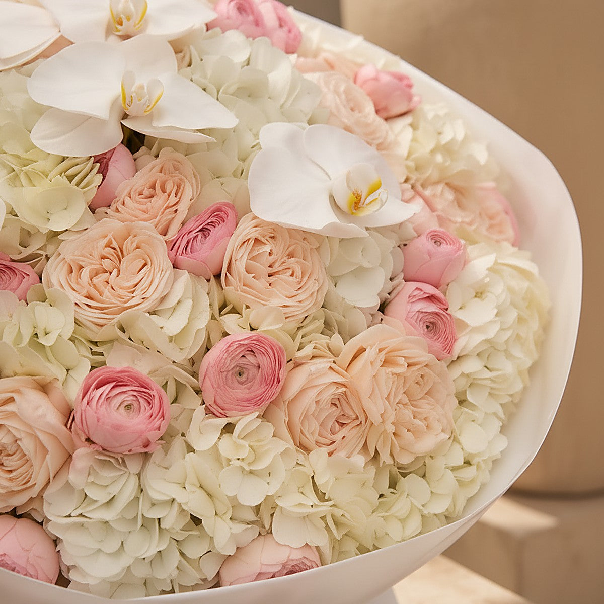 Lifestyle shot of Ivory Orchid refined luxury bouquet by Aiwa Flowers Dubai