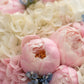 Noctelle pink peony bouquet with white hydrangea wrapped in dramatic black by Aiwa Flowers Dubai