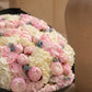 Top-down view of Noctelle hand-tied bouquet in black wrap by Aiwa Flowers Dubai