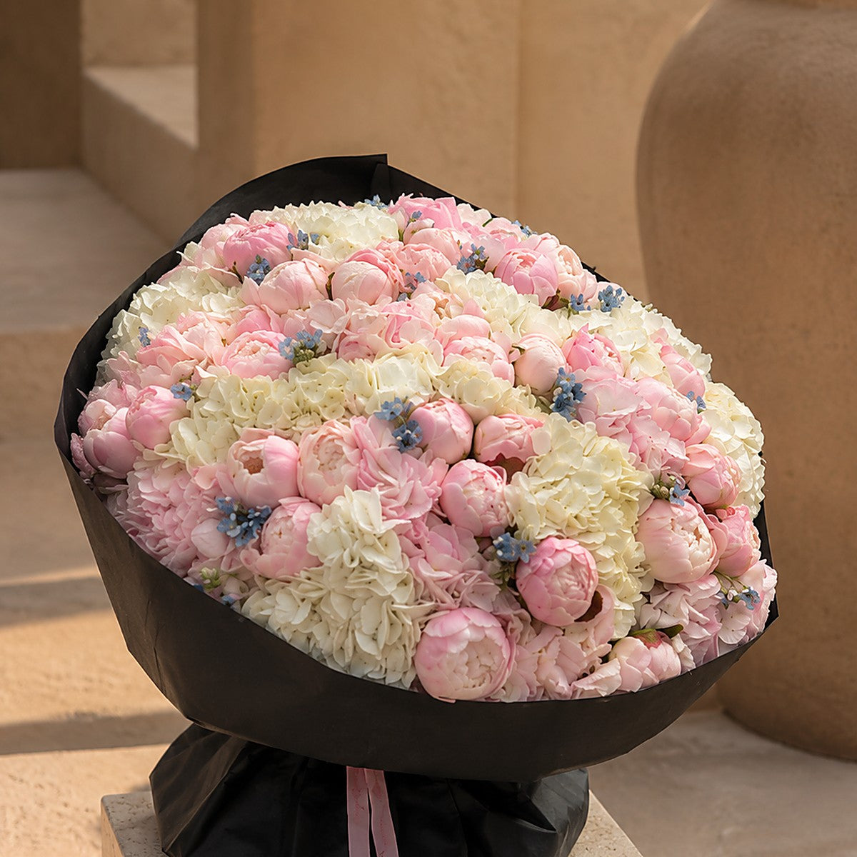Lifestyle shot of Noctelle dramatic luxury bouquet by Aiwa Flowers Dubai