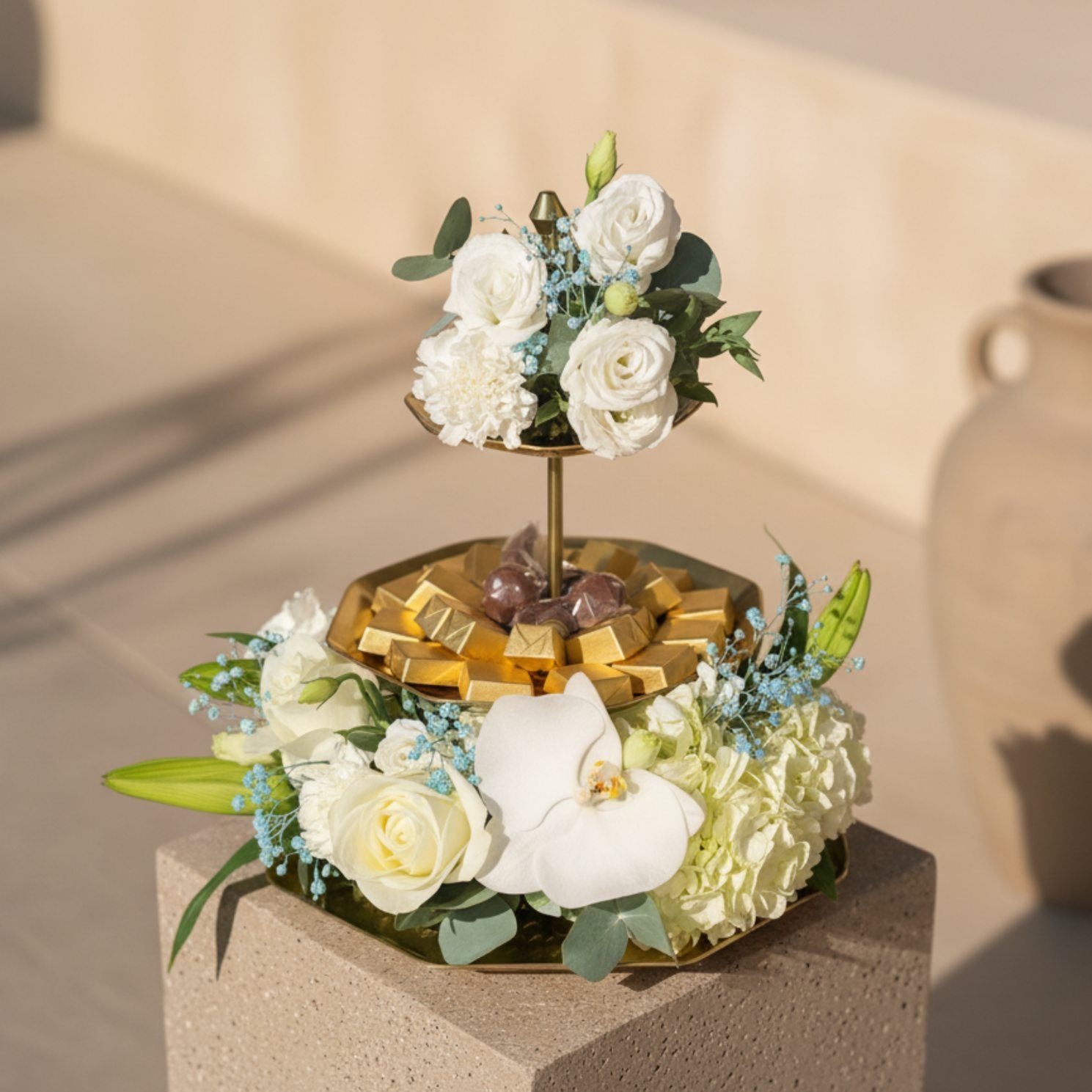 Oh Baby Chocolate Tray 3 floral arrangement with white roses, carnations, lisianthus, lilies, hydrangea, orchid, and chocolates on a serving tray by Aiwa Flowers Dubai