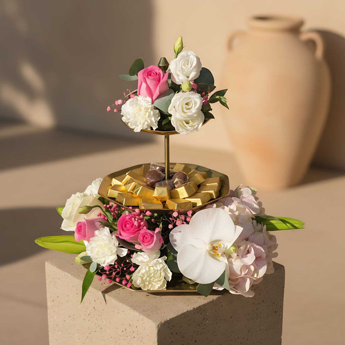 Oh Baby Chocolate Tray 4 floral arrangement with pink roses, white carnations, lisianthus, lily, hydrangea, orchid, and chocolates on a serving tray by Aiwa Flowers Dubai