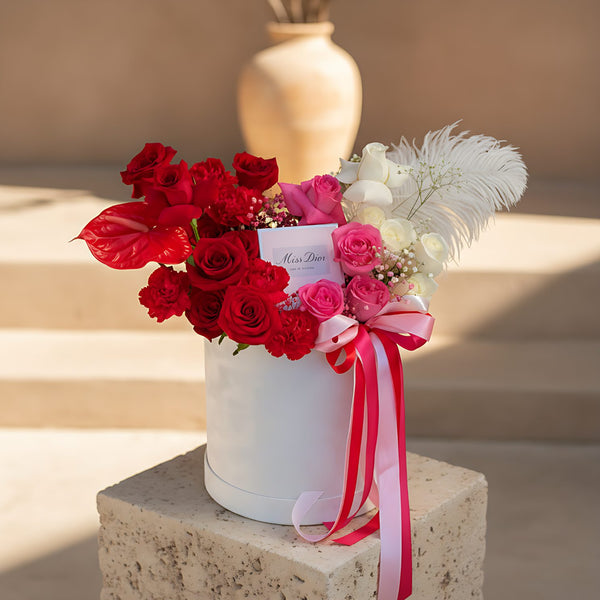 Ombre white velvet box arrangement with roses, carnations, anthurium, gypsophila, and Miss Dior perfume by Aiwa Flowers Dubai