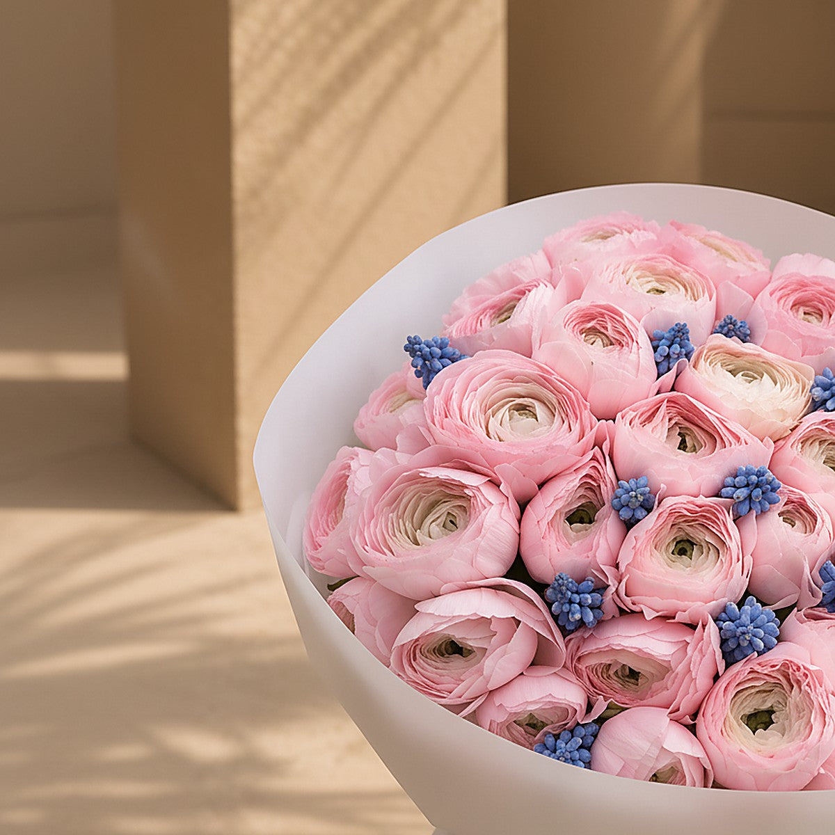 Side angle of Powder Bloom showing 50-ranunculus delicate fullness by Aiwa Flowers Dubai