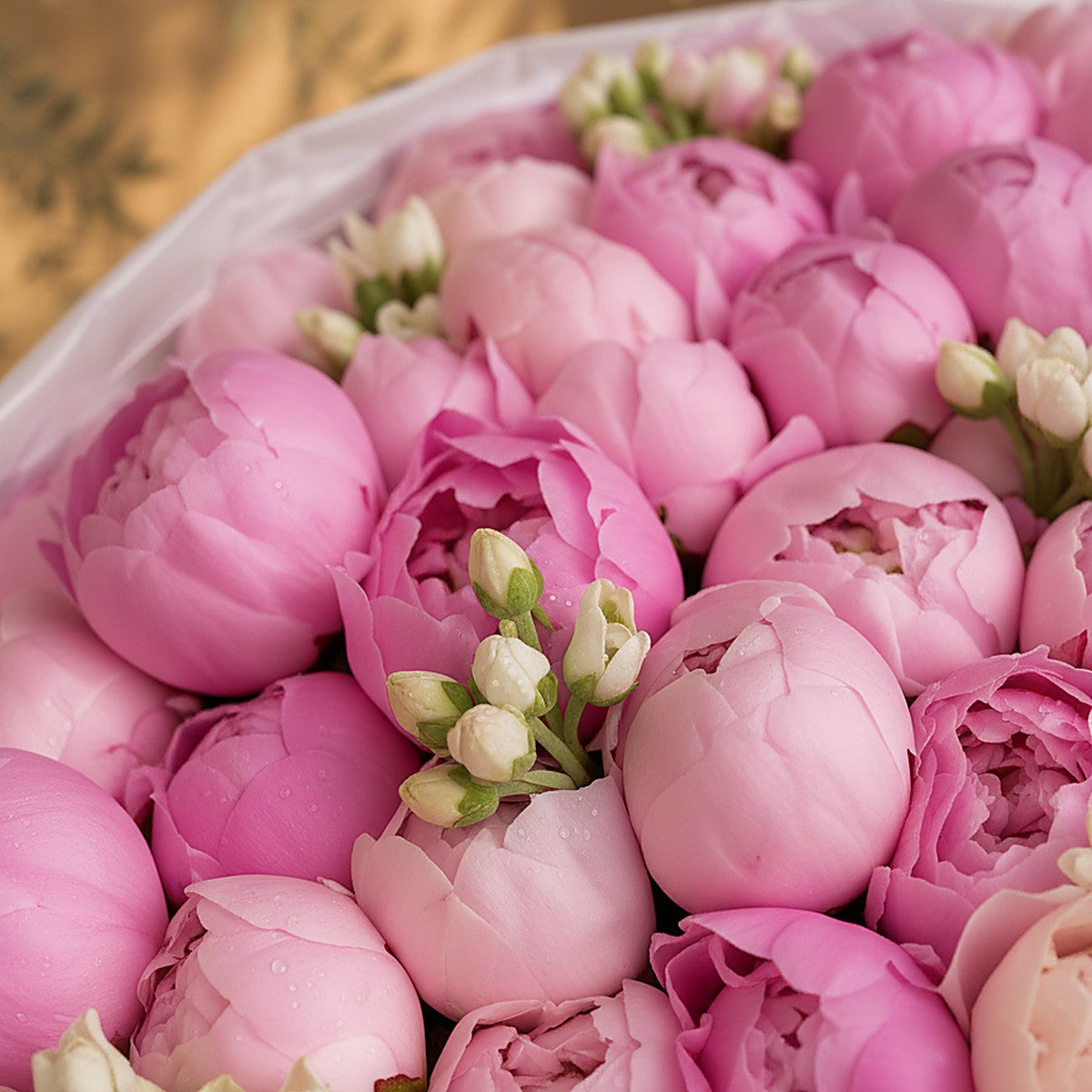 Rosabelle pink peony bouquet with white freesia wrapped in white by Aiwa Flowers Dubai
