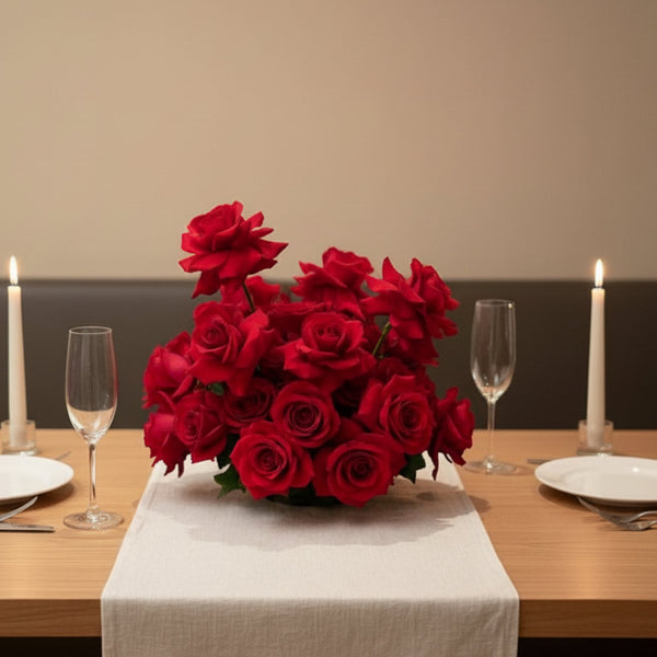 Luxury rose floral centerpiece arranged in a low vase for elegant dining table decoration.
