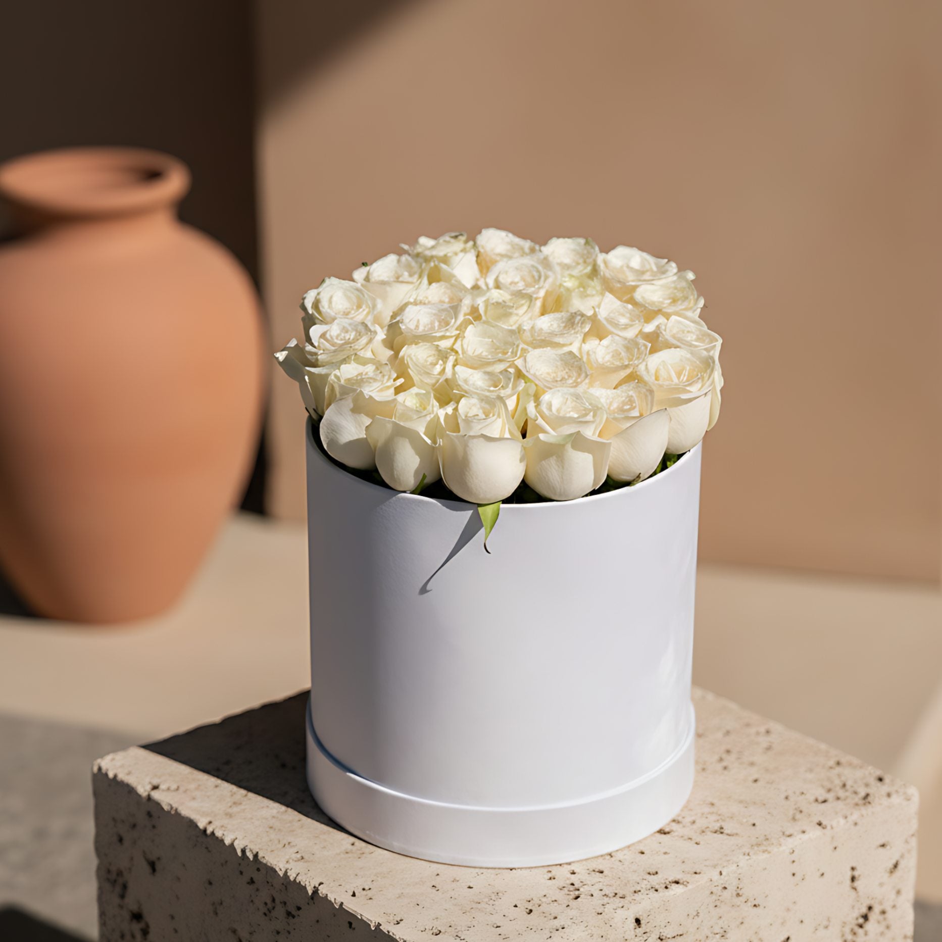 Snow-white white velvet box arrangement with fresh white roses by Aiwa Flowers Dubai