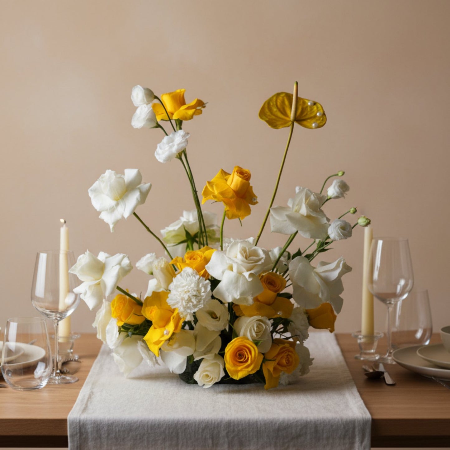Solar Bloom rose centerpiece with golden yellow and ivory roses arranged in a sculptural garden-style table arrangement.