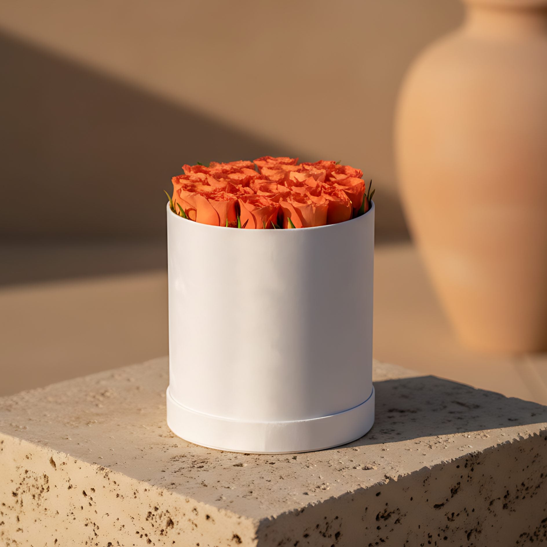 White velvet box arrangement with 21–26 fresh orange roses