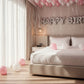 full room decorated with pink and white helium balloons ceiling and birthday banner Dubai
