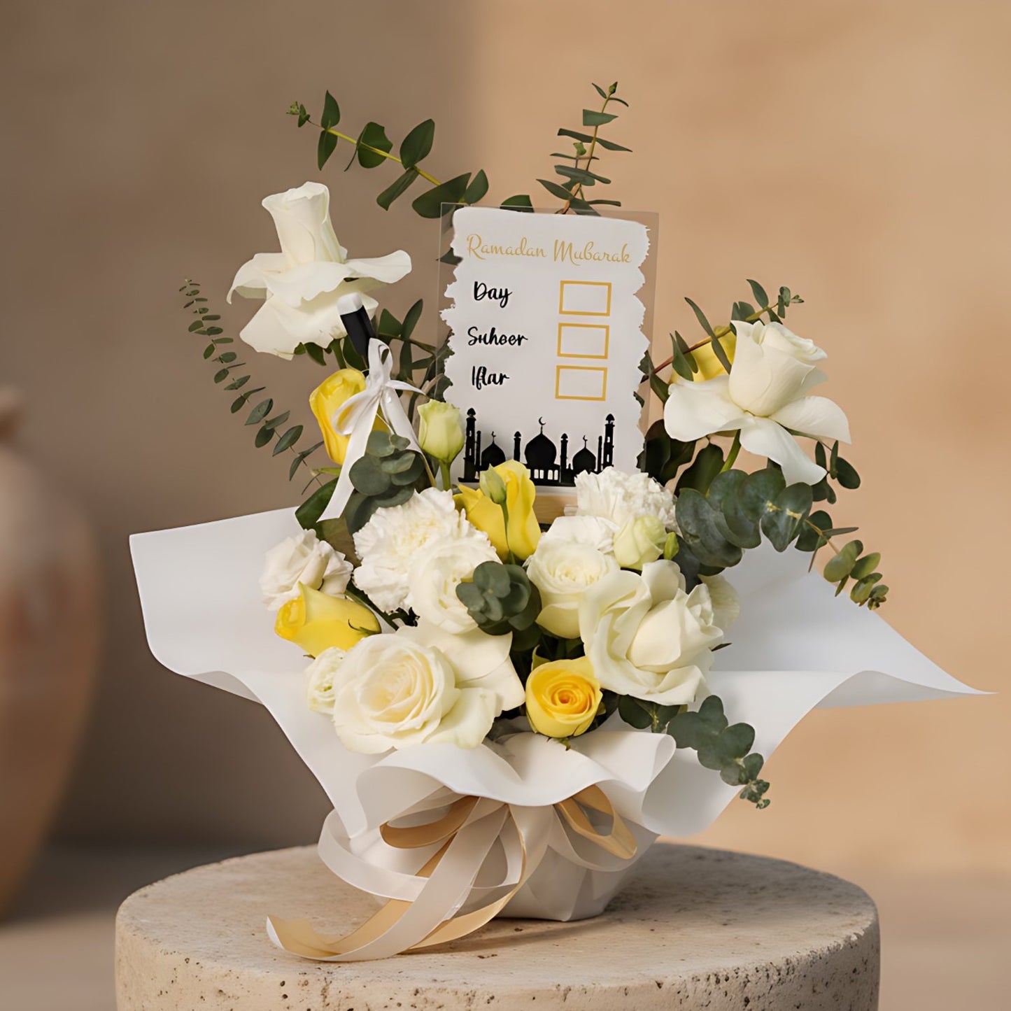 Luxury Ramadan bouquet with yellow and white roses, white lisianthus, carnations, eucalyptus, and a decorative Ramadan countdown calendar, wrapped in elegant white packaging, delivered in Dubai.