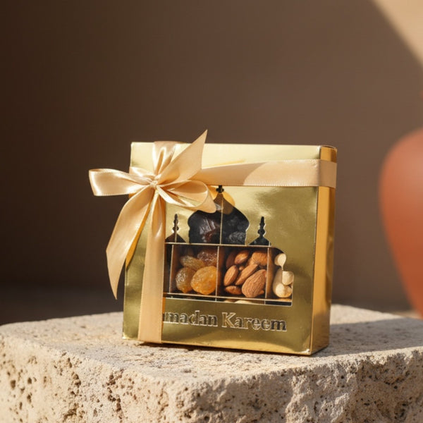 Luxury Ramadan gift box featuring an assortment of premium nuts and dates, presented in an elegant gold Ramadan-themed box, available for delivery in Dubai.