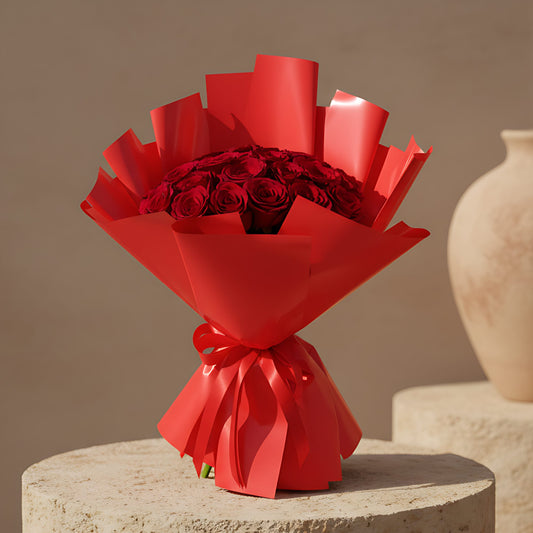 Hand-tied bouquet of 25 fresh red roses wrapped in elegant red paper